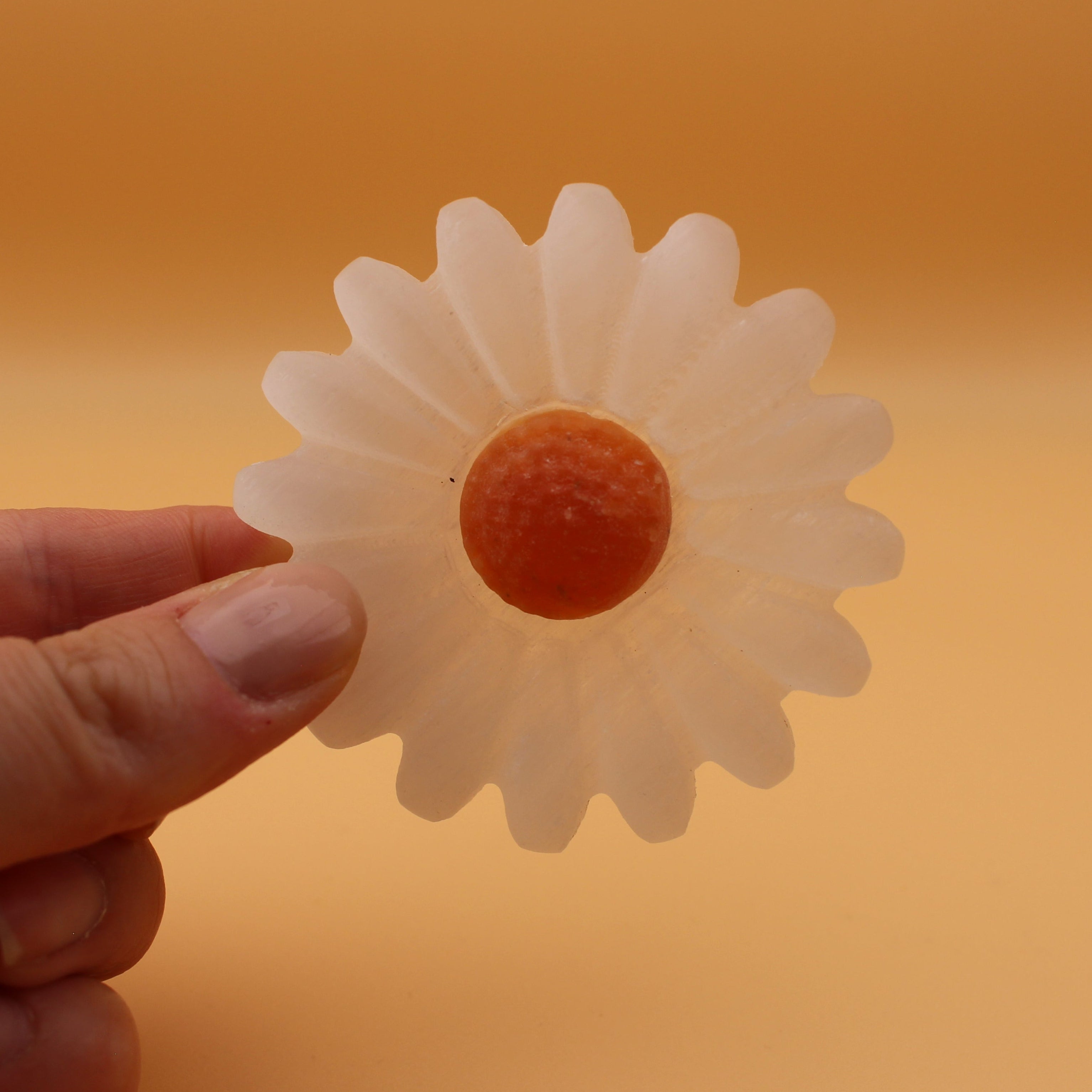 Selenite daisy with orange calcite – symbol of purity and joie de vivre